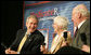 President George W. Bush participates in a Conversation on the Medicare Prescription Drug Benefit, Tuesday, March 14, 2006 at the Canandaigua Academy in Canandaigua, N.Y., speaking with Bob and Eleanor Wisnieff. White House photo by Kimberlee Hewitt