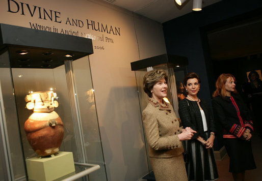 Mrs. Laura Bush, accompanied by Mrs. Marta Sahagun de Fox and Mrs. Eliane Karp de Toledo, talks with reporters following her tour of the Divine and Human: Women in Mexico and Peru Exhibit, Tuesday, March 14, 2006 at The National Museum of Women in the Arts in Washington. White House photo by Shealah Craighead