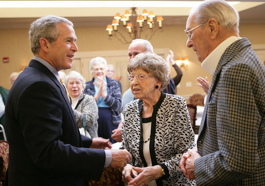 President George W. Bush is applauded as he arrives Tuesday, March 14, 2006 to the Ferris Hills at West Lake Senior Center in Canandaigua, N.Y., to discuss the benefits of the new Medicare prescription drug program. White House photo by Kimberlee Hewitt
