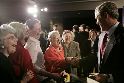 President George W. Bush meets with audience members following his remarks on the new Medicare Prescription Drug Benefit Program at the Riderwood Villiage retirement community, Wednesday, March 15, 2006 in Silver Spring, Md. President Bush urged seniors to get information about the new Medicare benefit program and sign up by the May 15th deadline. White House photo by Paul Morse