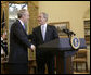 President George W. Bush and Idaho Gov. Dirk Kempthorne exchange handshakes in the Oval Office after the President announced Thursday, March 16, 2006, his intention to nominate the Governor to be Secretary of the Interior. White House photo by Paul Morse
