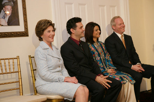 Mrs. Laura Bush attends the Afghan Children's Initiative Benefit Dinner at the Afghanistan Embassy in Washington, DC on Thursday evening, March 16, 2006. Seated with Mrs. Bush are Dr. Khaled Hosseini, author of The Kite Runner; Mrs. Shamim Jawad, host and wife of the Afghan Ambassador to the U.S.; and Mr. Tim McBride, member of the U.S.-Afghan Women's Council. White House photo by Shealah Craighead