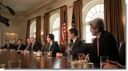 President George W. Bush meets with members of Congress Thursday, March 16, 2006, in the Cabinet Room of the White House. The President thanked the attendees and singled out Sen. John Kerry (D-Mass.) saying, "I can remember on the campaign trail, he said that he supported a line-item veto, and he is following through on his word by being here at the table."  White House photo by Paul Morse