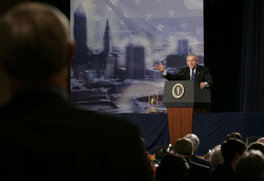 President George W. Bush answers a question from an audience member at the Renaissance Cleveland Hotel in Cleveland, Ohio, following his remarks on the global war on terror, Monday, March 20, 2006, to members of the City Club of Cleveland. White House photo by Paul Morse