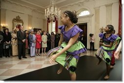 President George W. Bush and Mrs. Laura Bush join Liberia's President Ellen Johnson Sirleaf in viewing a dance performance by Moving in the Spirit, on the State Floor of the White House, Tuesday, March 21, 2006, prior to a social luncheon in honor of President Sirleaf.  White House photo by Eric Draper