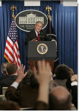 President George W. Bush answers reporters questions, Tuesday morning, March 21, 2006, during a news briefing at the White House.  White House photo by Paul Morse