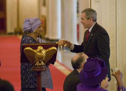 President George W. Bush toast Liberia's President Ellen Johnson Sirleaf, Tuesday, March 21, 2006, at a social luncheon at the White House in honor of President Sirleaf. White House photo by Eric Draper