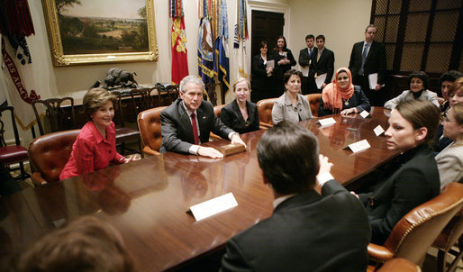 President George W. Bush and Mrs. Laura Bush meet Tuesday, March 21, 2006 in the Roosevelt Room of the White House, with members of the Iraq and Afghanistan Non-Govermental Organizations. White House photo by Eric Draper