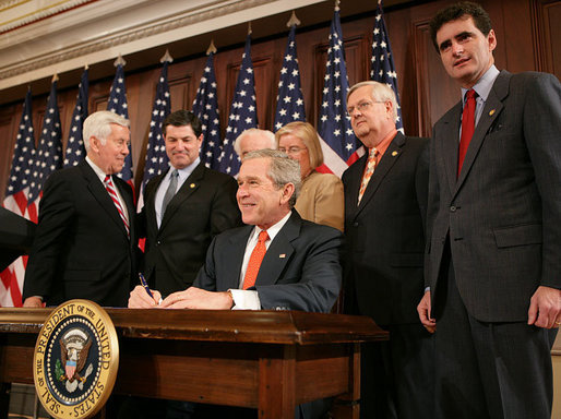 President George W. Bush is joined by members of Congress as he signs H.R. 1053, to authorize the Extension of Nondiscriminatory Treatment to the Products of Ukraine, Thursday, March 23, 2006, in the Eisenhower Executive Office Building in Washington. President Bush is joined by, from left to right, U.S. Sen. Richard Lugar, R- Ind.; U.S. Rep. Jim Gerlach, R-Pa.; U.S. Rep. Tom Lantos, D-Calif.; U.S. Rep. Candice Miller, R-Mich; U.S. Rep. Curt Weldon, R-Pa., and U.S. Rep. Mike Fitzpatrick, R-Pa. White House photo by Kimberlee Hewitt