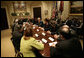 President George W. Bush speaks with participants in a meeting on immigration reform Thursday, March 23, 2006, in the Roosevelt Room of the White House.  White House photo by Eric Draper