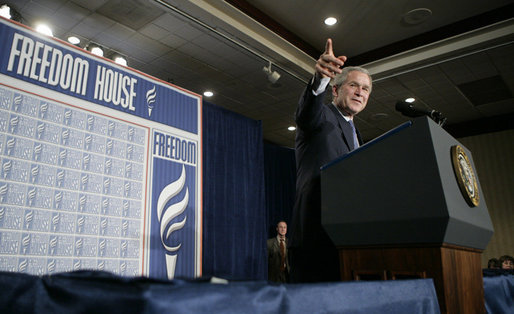 President George W. Bush takes a question from the audience at Freedom House, Wednesday, March 29, 2006 in Washington, where President Bush discussed Democracy in Iraq and thanked the Freedom House organization for their work to expand freedom around the world. White House photo by Eric Draper