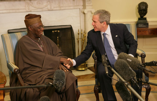 President George W. Bush welcomes Nigerian President Olusegun Obasanjo to the Oval Office Wednesday, March 29, 2006. White House photo by Shealah Craighead