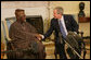 President George W. Bush welcomes Nigerian President Olusegun Obasanjo to the Oval Office Wednesday, March 29, 2006. White House photo by Shealah Craighead