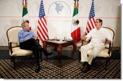 President George W. Bush meets with Mexican President Vicente Fox, Thursday, March 30, 2006, during their bilateral meeting in Cancun, Mexico. The meeting is part of a three-day summit with the leaders of Mexico and Canada. White House photo by Eric Draper