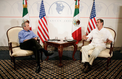 President George W. Bush meets with Mexican President Vicente Fox, Thursday, March 30, 2006, during their bilateral meeting in Cancun, Mexico. The meeting is part of a three-day summit with the leaders of Mexico and Canada. White House photo by Eric Draper
