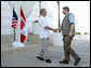 President George W. Bush shakes hands with Canadian Prime Minister Stephen Harper, Thursday, March 30, 2006 in Cancun, Mexico, in their first meeting since Harper was elected Prime Minister. President Bush is participating in a three-day summit with the leaders of Mexico and Canada. White House photo by Kimberlee Hewitt