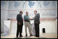 President George W. Bush, Mexico's President Vicente Fox, center, and Canadian Prime Minister Stephen Harper, right, meet to shake hands following their joint news conference, Friday, March 31, 2006 in Cancun, Mexico, at the conclusion of their summit meeting. White House photo by Eric Draper