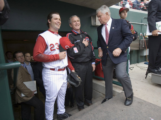 President George W. Bush stands with Reds catcher Jason LaRue and team CEO Bob Castellini during the opening game between the Cincinnati Reds and the Chicago Cubs in Cincinnati, Ohio, Monday, April 3, 2006. White House photo by Eric Draper