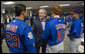 President George W. Bush talks with Cubs outfielders Angel Pagan, left, and Matt Murton before the opening game between the Cincinnati Reds and the Chicago Cubs in Cincinnati, Ohio, Monday, April 3, 2006. White House photo by Eric Draper