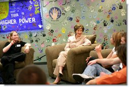 As part of the Helping America's Youth initiative, Mrs. Laura Bush visits the Preferred Family Healthcare Adolescent Substance Abuse Rehabilitation Center, and talks with 18 year-old Dalton Fox about the progress of her recovery from substance abuse addiction on Tuesday, April 4, 2006, in St. Louis, Mo. PFH specializes in individual customer care, by focusing on strengthening individual skills, attitudes, and behaviors that maximizes the opportunity for each person to achieve and maintain recovery.  White House photo by Shealah Craighead