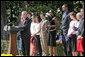 President George W. Bush congratulates the 2005 and 2006 NCAA Championship teams during a South Lawn ceremony Thursday, April 6, 2006. White House photo by Kimberlee Hewitt