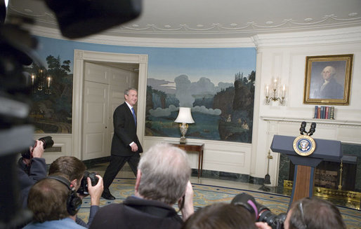 President George W. Bush walks into the Diplomatic Reception Room where he addressed the press Friday, April 7, 2006. "Good morning, This morning's economic report shows that America's growing economy added 211,000 jobs in the month of March," said the President. "The American economy has now added jobs for 31 months in a row, created more than 5.1 million new jobs for American workers. The unemployment rate is now down to 4.7 percent -- that's below the average rate of the 1960s, 1970s, 1980s and 1990s." White House photo by Kimberlee Hewitt