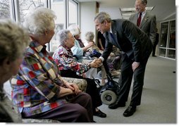 President George W. Bush and Senator Charles, Grassley, R-Iowa, greet residents at Wesley Acres Senior Center in Des Moines, Iowa, Tuesday, April 11, 2006. The President visited Iowa to talk about the Medicare prescription drug benefits. "Every senior is saving money, and that's what people have got to know," said the President. "There is an easy way to find out how the program works, and that's to call 1-800-Medicare, or you can go on the computer systems at Medicare.gov." White House photo by Eric Draper