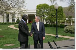 After meeting in the Oval Office,President George W. Bush and President John Kufuor of Ghana shake hands during a joint statement to the press on the South Lawn Wednesday, April 12, 2006. "We just had a wonderful discussion about our bilateral relations, and a great discussion about the world. I really enjoy talking to a man of vision and strength and character. President Kufuor has done a fantastic job for Ghana," said President Bush. "He's told the people of his country he'd bring honesty to government, and he has. He told the people of his country that he would work to create a stable economic platform for -- and he has done that, as well. And he's a man of peace. He cares deeply about peace in the region."  White House photo by Kimberlee Hewitt