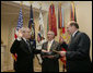 New Chief of Staff Josh Bolten is joined by outgoing Chief of Staff Andrew Card as Bolten is sworn-in by Deputy Chief of Staff Joe Hagin, right, Friday, April 14, 2006 in the Roosevelt Room of the White House. White House photo by Paul Morse