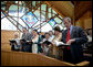President George W. Bush and Mrs. Bush participate in an Easter service at the Evergreen Chapel at Camp David, Maryland, Sunday, April 16, 2006. Also pictured in front row, from right, are Jenna Welch, Barbara Bush, Former President George H. W. Bush and First Lady Barbara Bush. White House photo by Eric Draper