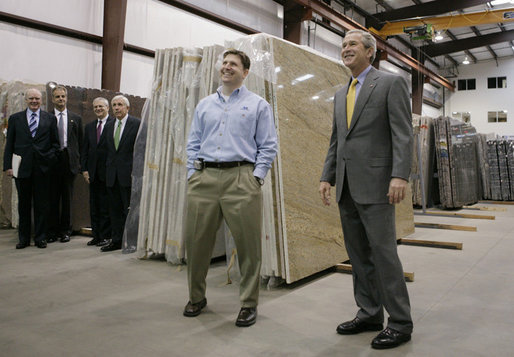 President George W. Bush tours the Europa Stone Distributors, Inc. facility in Sterling, Va., with company Vice President Adam Mahmud, Monday, April 17, 2006. Following the tour President Bush, who was joined by U.S. Treasury Secretary John Snow, U.S. Rep. Frank Wolf, R-Va., and White House Chief of Staff Josh Bolten, left, participated in a roundtable discussion on taxes and the economy. White House photo by Paul Morse
