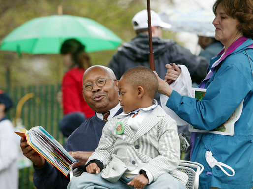 U.S. Secretary of Housing and Urban Development Alphonso Jackson is joined by family friend Willard Jackson Jr., as he reads to a gathering of children at the 2006 White House Easter Egg Roll, Monday, April 17, 2006 on the South Lawn of the White House. White House Photo by Julie Kubal 