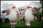 White House staff volunteers dressed in festive egg costumes stroll the South Lawn of the White House during the 2006 White House Easter Egg Roll, Monday, April 17, 2006. White House photo by Kimberlee Hewitt