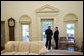 President George W. Bush and Prime Minister Fouad Siniora of Lebanon talk privately in the Oval Office Tuesday, April 18, 2006. White House photo by Eric Draper