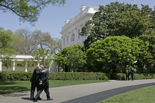 President George W. Bush walks with Prime Minister Fouad Siniora of Lebanon after addressing the press on the South Lawn Tuesday, April 18, 2006. "Well, we just had a really interesting discussion. I told the Prime Minister that the United States strongly supports a free and independent and sovereign Lebanon. We took great joy in seeing the Cedar Revolution," said President Bush. "We understand that the hundreds of thousands of people who took to the street to express their desire to be free required courage, and we support the desire of the people to have a government responsive to their needs and a government that is free, truly free." White House photo by Paul Morse