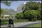 President George W. Bush walks with Prime Minister Fouad Siniora of Lebanon after addressing the press on the South Lawn Tuesday, April 18, 2006. "Well, we just had a really interesting discussion. I told the Prime Minister that the United States strongly supports a free and independent and sovereign Lebanon. We took great joy in seeing the Cedar Revolution," said President Bush. "We understand that the hundreds of thousands of people who took to the street to express their desire to be free required courage, and we support the desire of the people to have a government responsive to their needs and a government that is free, truly free." White House photo by Paul Morse