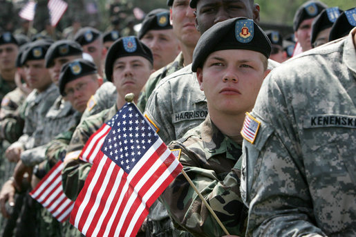 Soldiers listen as Vice President Dick Cheney delivers remarks at a rally at Fort Riley Army Base in Kansas, Tuesday, April 18, 2006. During his address the vice president recognized the 3rd Brigade Combat Team of the 24th Infantry Division by welcoming them home from their recent tour in Iraq and thanking them for their service and support during the Iraqi elections. White House photo by David Bohrer
