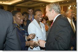 President George W. Bush greets members of the audience after speaking Wednesday, April 19, 2006, at Tuskegee University in Tuskegee, Alabama. White House photo by Paul Morse