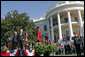 President George W. Bush and Chinese President Hu Jintao stand for the playing of the two countries' national anthems during the beginning of the South Lawn Arrival Ceremony Thursday, April 20, 2006. White House photo by Shealah Craighead