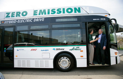 President George W. Bush listens to AC Transit Employee Jamie Levin while standing in the doorway of a bus powered by fuel cell technology during a tour of the California Fuel Cell Partnership in West Sacramento, California, Saturday, April 22, 2006. White House photo by Eric Draper