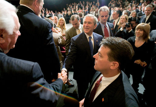 President George W. Bush reaches out to shake the hand of an audience member Monday, April 24, 2006, after addressing the Orange County Business Council in Irvine, Calif. White House photo by Eric Draper