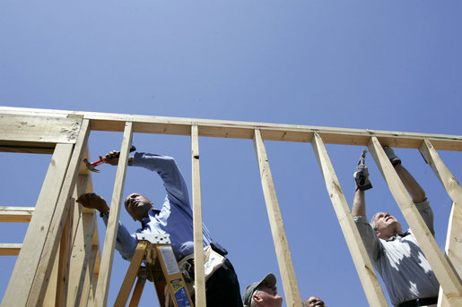 President George W. Bush hammers nails with New Orleans Mayor Ray Nagin on a home constructed by volunteers in the Upper 9th Ward of New Orleans, Louisiana, Thursday, April 27, 2006. White House photo by Eric Draper