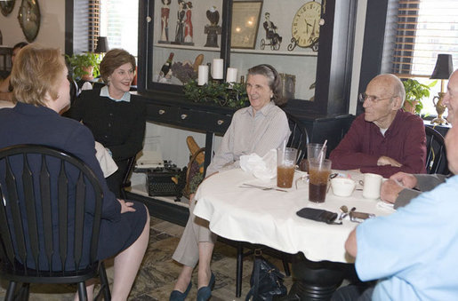 Mrs. Laura Bush and Mrs. Janet Huckabee, left, visit with patrons Tuesday, May 2, 2006 at Bailey’s Bakery in Ft. Smith, Ark. Mrs. Bush traveled to Arkansas to remind seniors of the May 15th enrollment deadline to sign-up for the Medicare Prescription Drug Benefit. White House photo by Kimberlee Hewitt