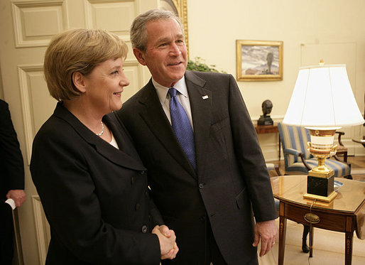 President George W. Bush welcomes German Chancellor Angela Merkel to the Oval Office at the White House, Wednesday, May 3, 2006. White House photo by Eric Draper