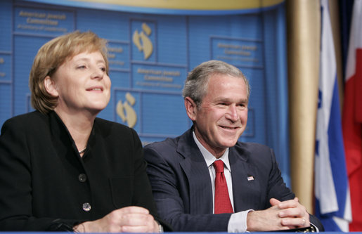 President George W. Bush shares a moment with Chancellor Angela Merkel of the Federal Republic of Germany, during the American Jewish Committee's Centennial Dinner Thursday, May 4, 2006, at the National Building Museum in Washington, D.C. White House photo by Paul Morse