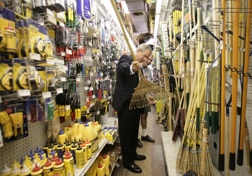 President George W. Bush looks over merchandise during a visit Frager's Hardware store in the Capitol Hill neighborhood of Washington, D.C., Friday, May 5, 2006. White House photo by Eric Draper
