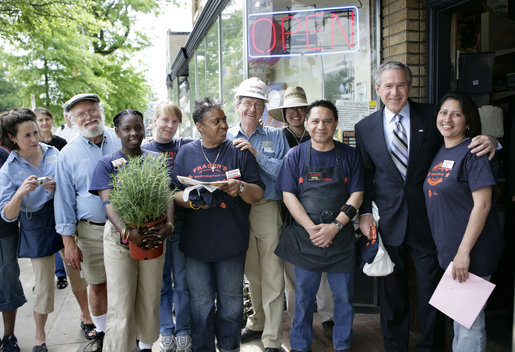 President George W. Bush stands with employees during a visit to Frager's Hardware store in the Capitol Hill neighborhood of Washington, D.C., Friday, May 5, 2006. White House photo by Eric Draper