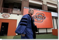 President George W. Bush walks onto the field of Boone Pickens Stadium at Oklahoma State University in Stillwater, OK where he delivered the commencement address to the class of 2006 on Saturday May 6, 2006.  White House photo by Paul Morse