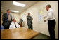 President George W. Bush and Florida Governor Jeb Bush receive a briefing on brush fires at the Hillsborough County Fire Station in Sun City Center, Florida, Tuesday, May 9, 2006. White House photo by Eric Draper