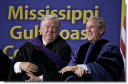 President and Mississippi Governor Haley Barbour attend the 2006 graduation class at Mississippi Gulf Coast Community College in Biloxi, Miss., Thursday, May 11, 2006. "You continued your studies in classrooms with crumbling walls. You lost homes, and slept in tents near campus to finish courses," said the President speaking about the students' experiences. "You cleared debris during the day and you went to class at night." White House photo by Paul Morse